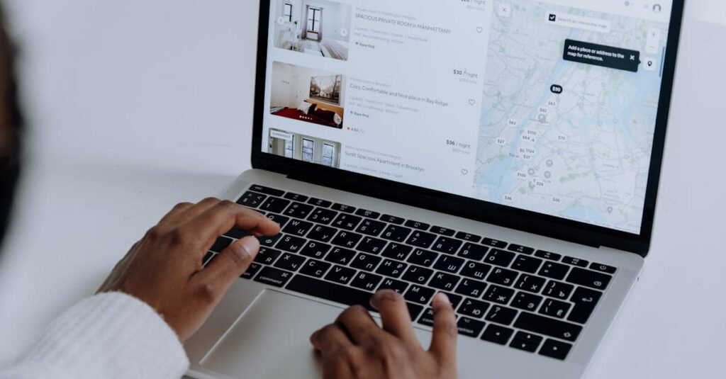 Person analysing a property listing on laptop