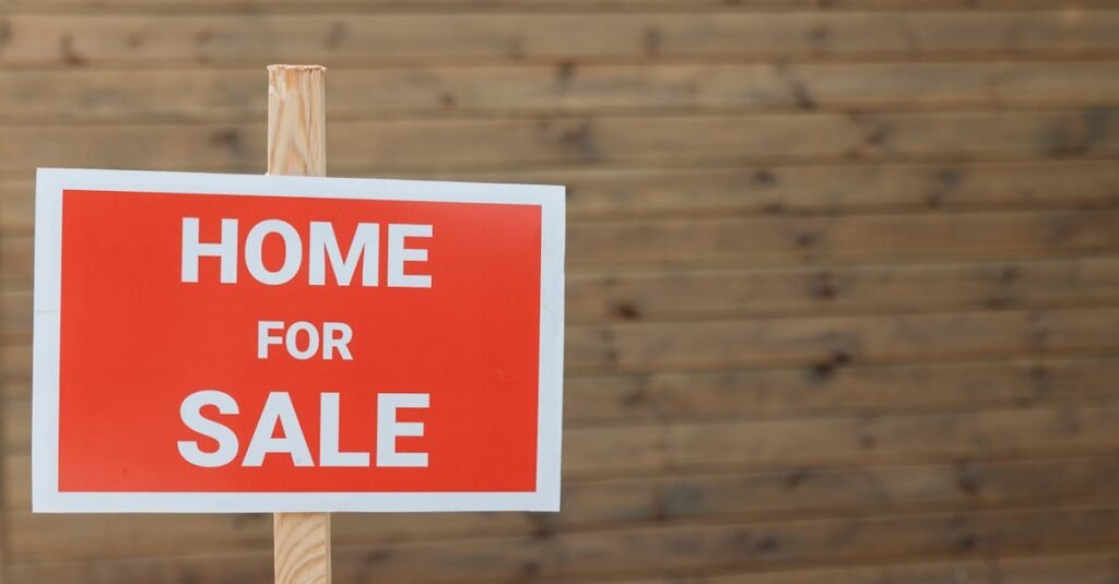 For sale sign outside a UK terraced house