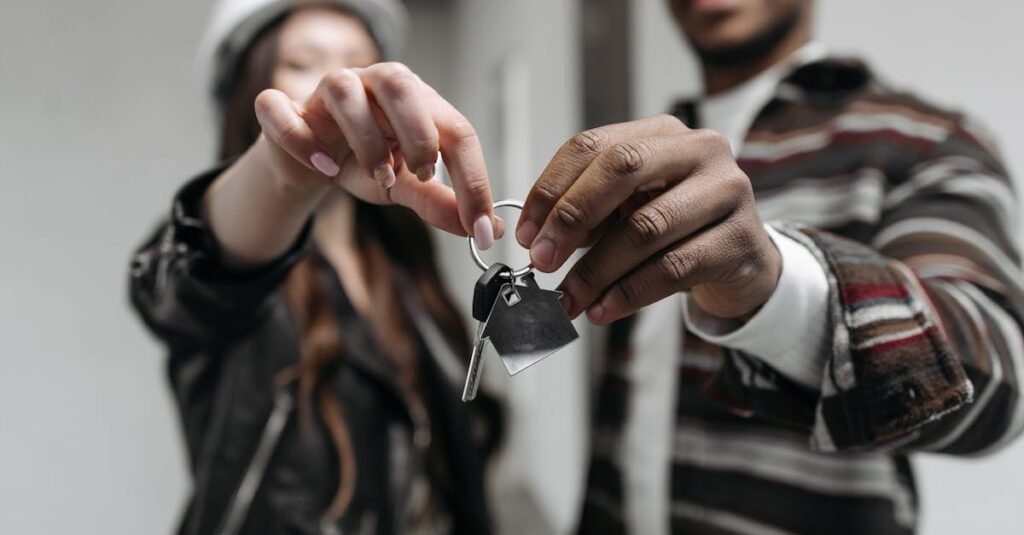 Landlord handing over property keys to tenant